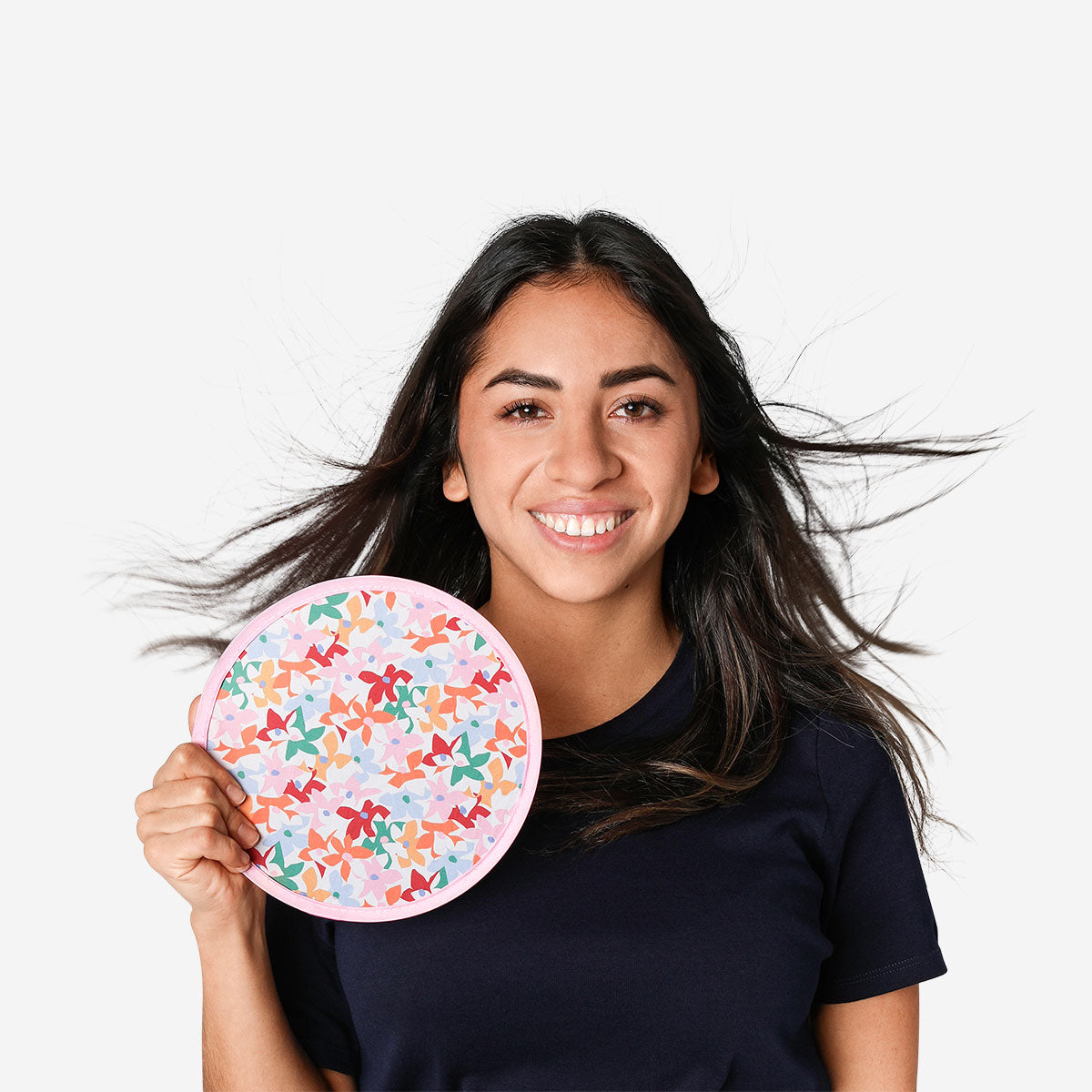Foldable textile fan with flower print from Flying Tiger Copenhagen, showing the colorful, portable fan in a folded position.