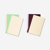 Set of four Flying Tiger Copenhagen A5 office notebooks with colorful covers, ideal for note-taking and organization.