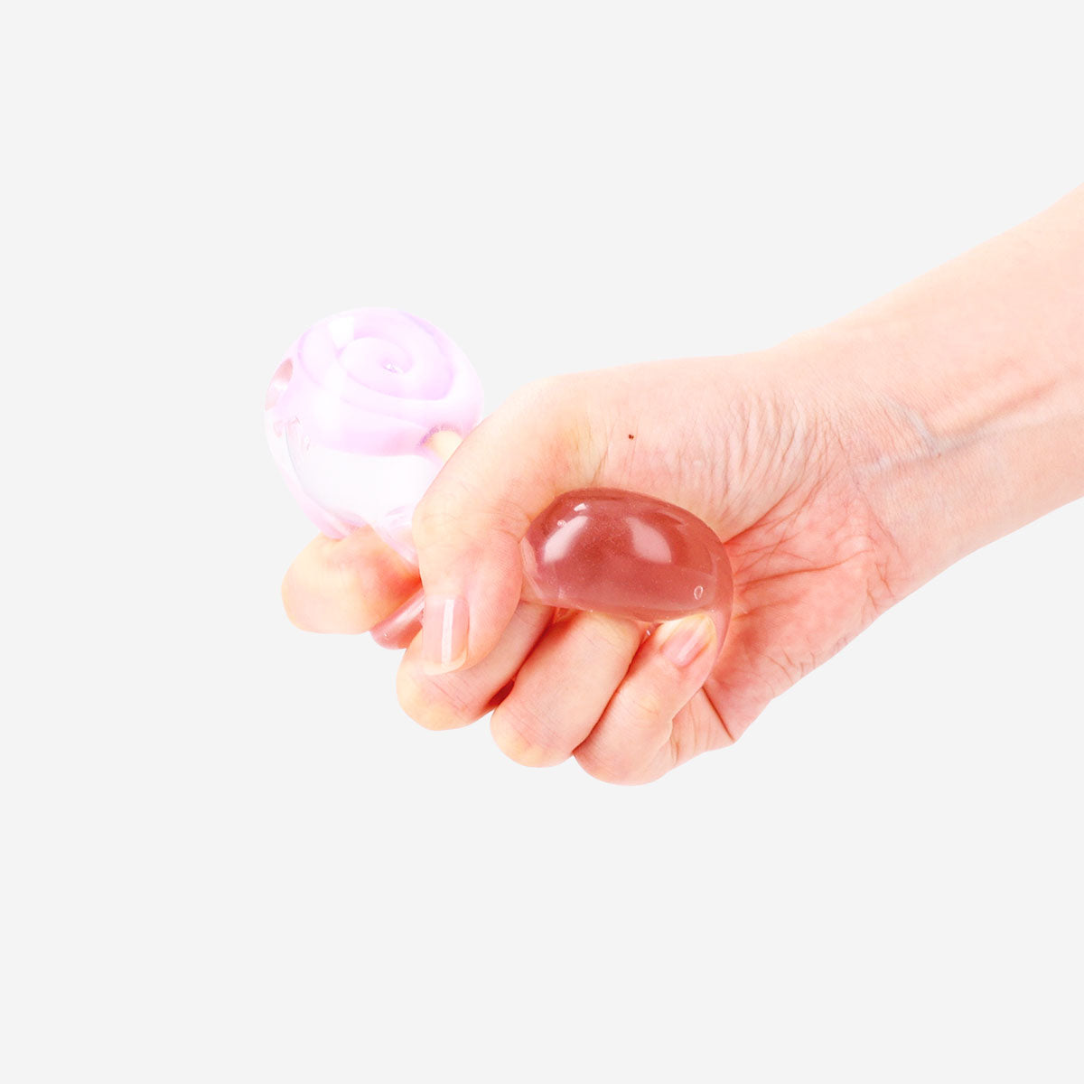 Purple lollipop-shaped fidget cube gadget from Flying Tiger Copenhagen with various tactile features for fidgeting.