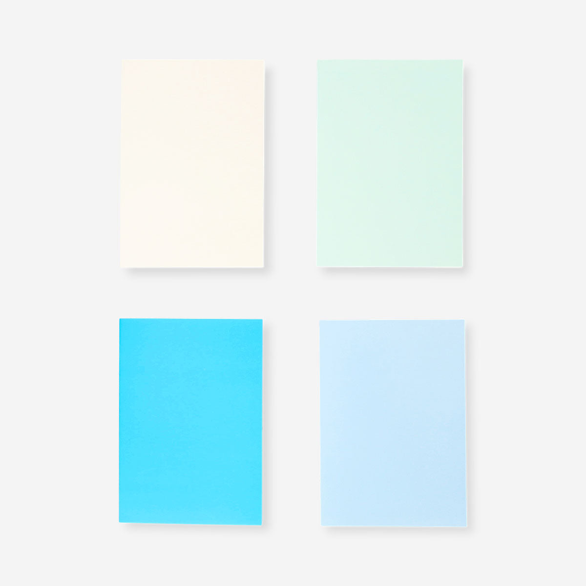 Set of four Flying Tiger Copenhagen A5 solid color notebooks for office or school use, featuring vibrant, smooth covers.