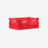 Red collapsible storage box for home organization by Flying Tiger Copenhagen, measuring 10x15 cm, shown folded and expanded.