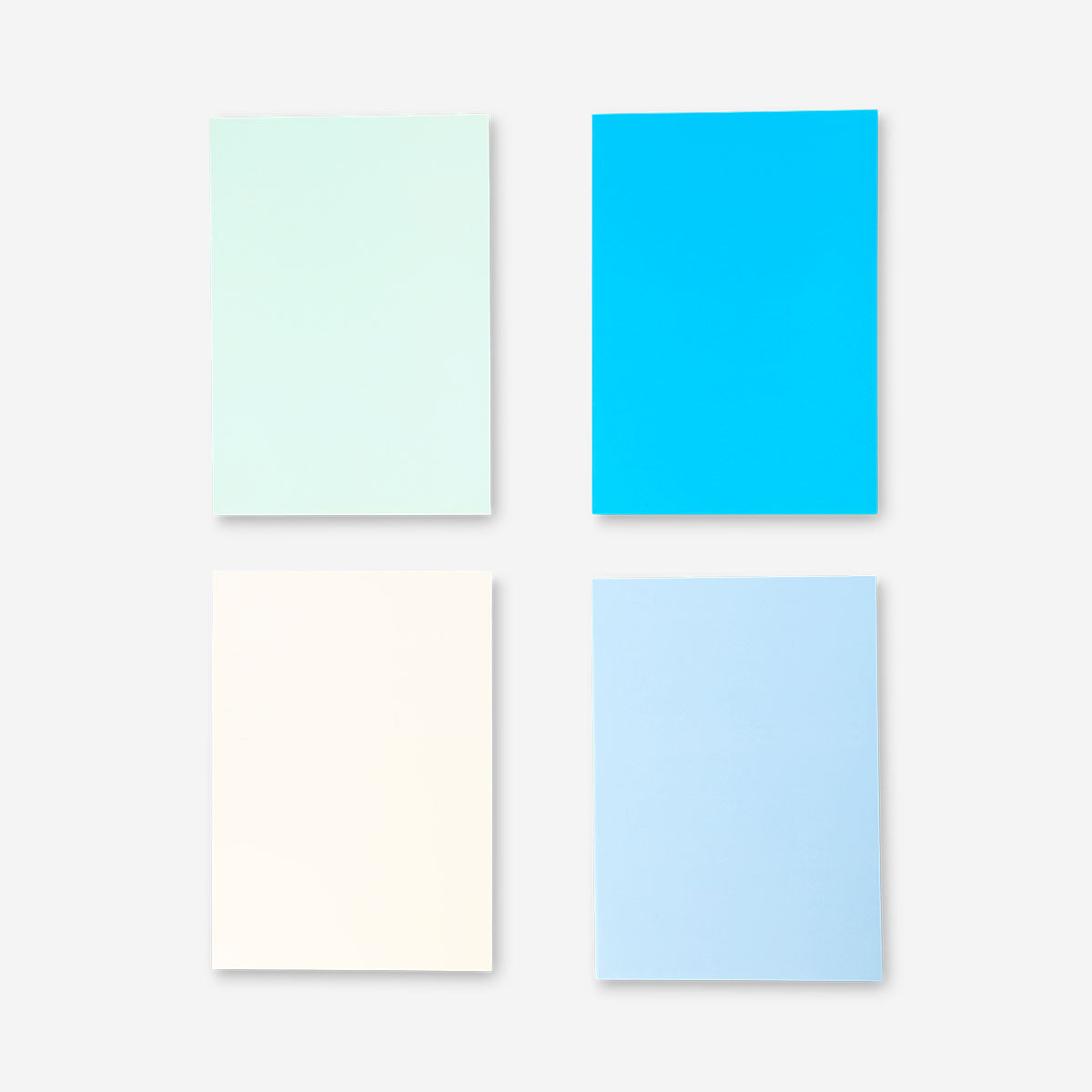 Set of four Flying Tiger Copenhagen B5 solid color notebooks for office or stationery use, with vibrant covers and clean pages.