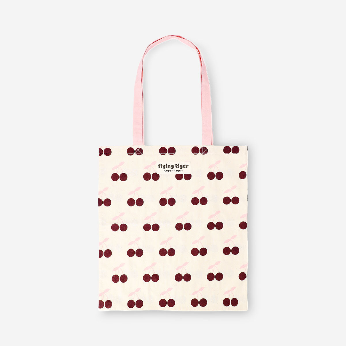 Pink and red cherry-print Flying Tiger Copenhagen tote bag made of textile with a spacious design and sturdy handles.