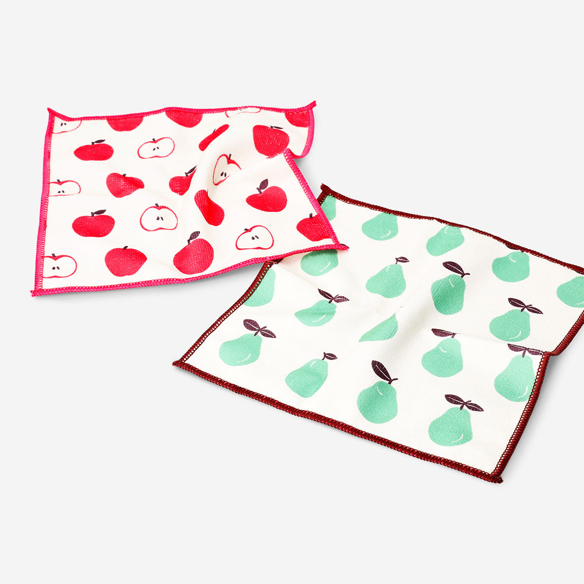 Two colorful kitchen cloths with fruit print from Flying Tiger Copenhagen, featuring vibrant, playful fruit designs.