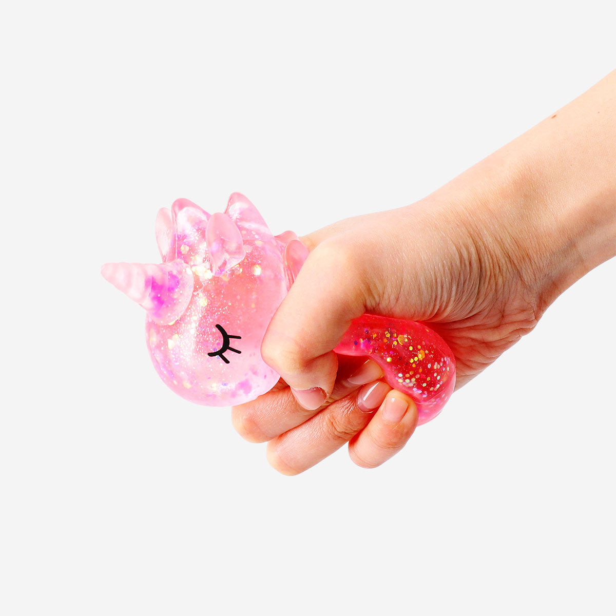 Pink flying unicorn fidget gadget from Flying Tiger Copenhagen, featuring a colorful unicorn design with a spinning mechanism.