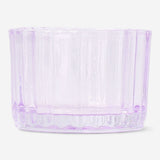 Purple glass tealight holder for home decor, featuring a smooth round design and transparent purple finish.
