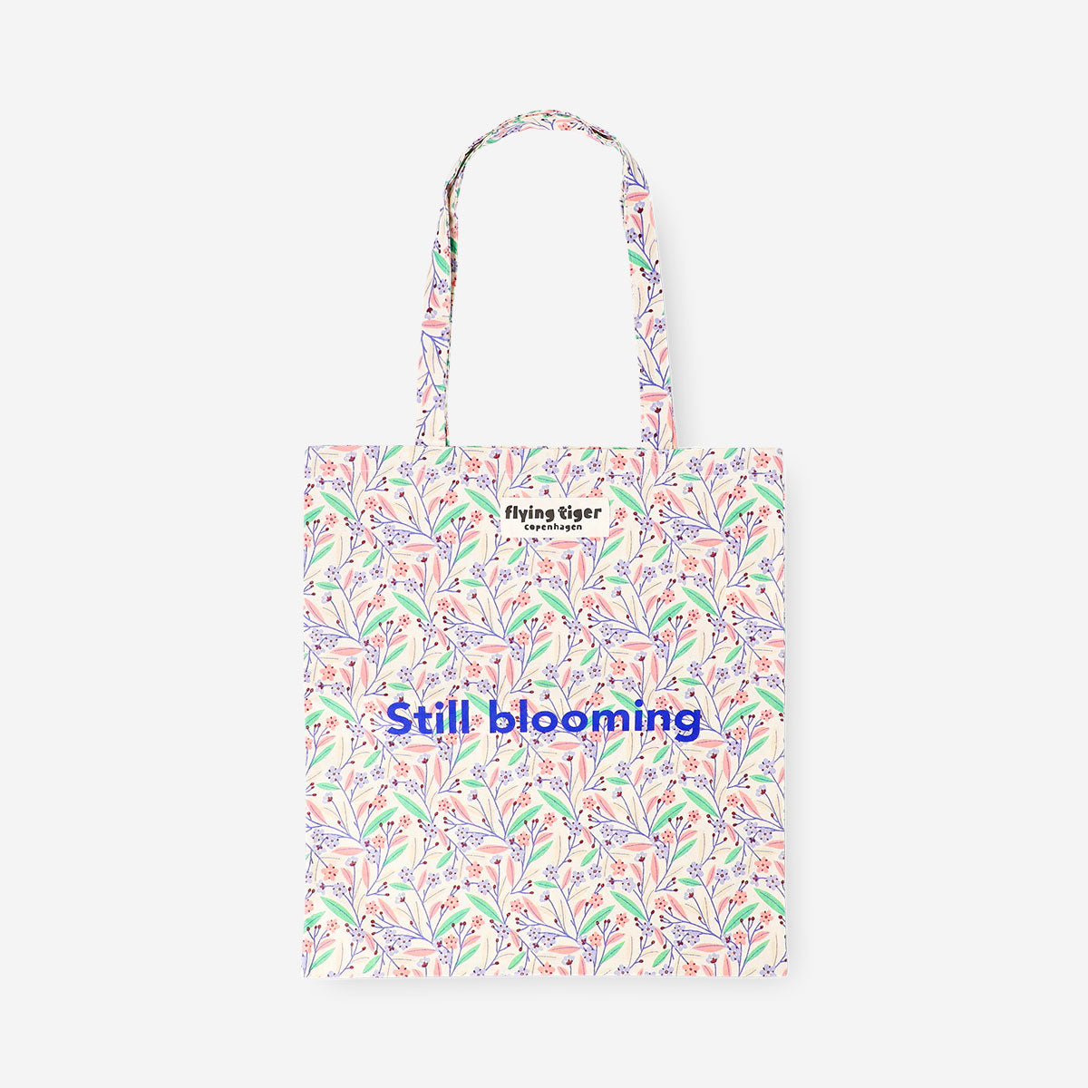 Flying Tiger Copenhagen tote bag with a colorful bloom textile design, featuring sturdy handles and spacious interior.