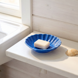 Blue ceramic seashell soap dish for home use, featuring a detailed seashell design from Flying Tiger Copenhagen.