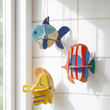 Three DIY cardboard fish craft kits from Flying Tiger Copenhagen, perfect for hobby projects and creative activities.