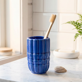 Blue ceramic seashell toothbrush holder from Flying Tiger Copenhagen, featuring a seashell design for home bathroom decor.