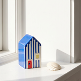 Decorative striped ceramic beach house in blue and white, 10 cm tall, by Flying Tiger Copenhagen for home décor.