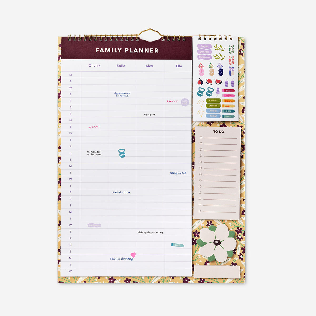 Family planner with colorful stickers and memo pages, designed for organizing family schedules and activities in an office setting.