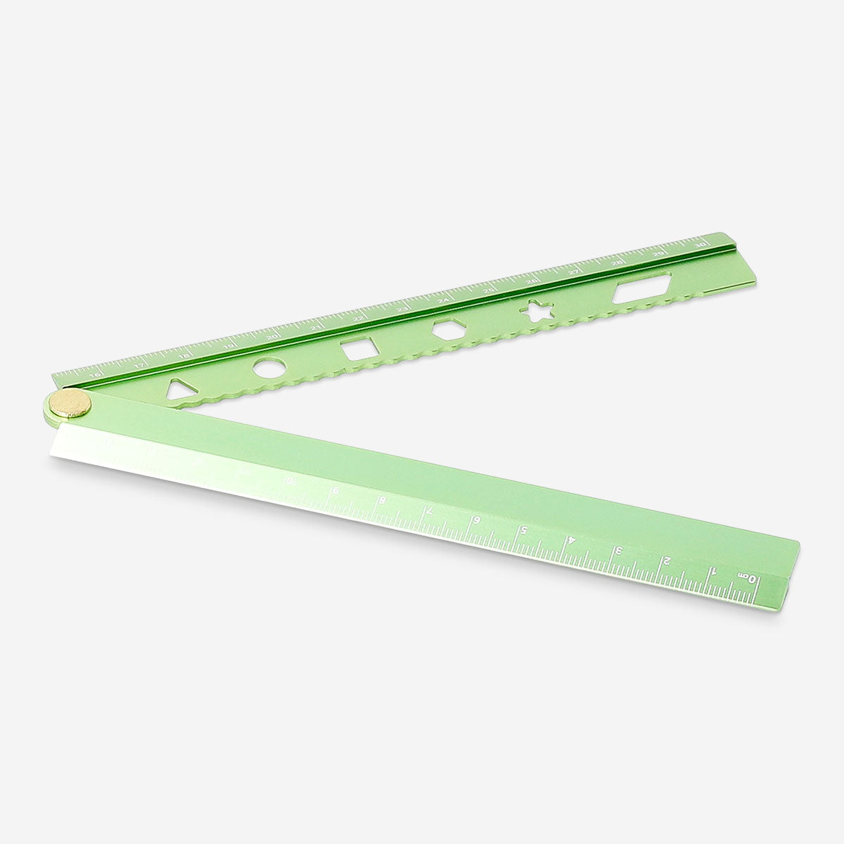 Green foldable office ruler with stencils from Flying Tiger Copenhagen, featuring measurement markings and stencil designs.