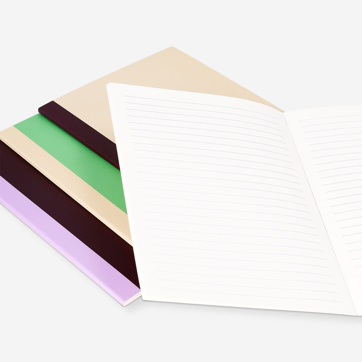 Set of four Flying Tiger Copenhagen A5 notebooks with colorful covers, ideal for office or school note-taking.